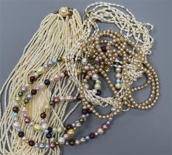 Four assorted necklaces including multi coloured cultured pearl and multi strand seed pearl.